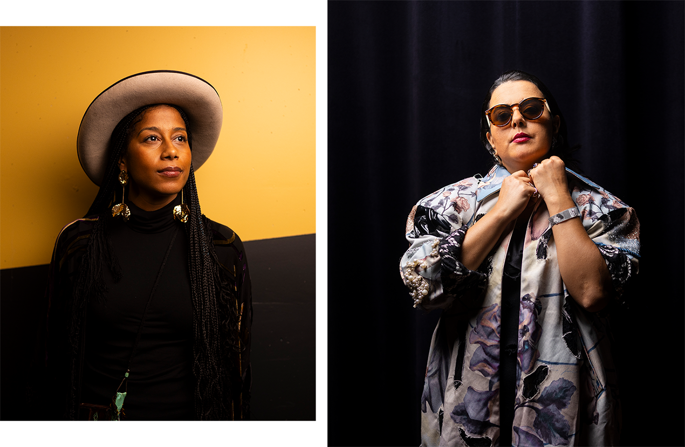 These are two portraits. In the first photo, you see aja monet. She is standing in front of a wall divided into a yellow and black area. aja monet is wearing a hat and striking gold earrings. The second photo shows Dina El Wedidi. She is standing in front of a dark curtain and using her hands to hold her long, flowered coat closed at the top. She is wearing sunglasses and looking towards the camera. 